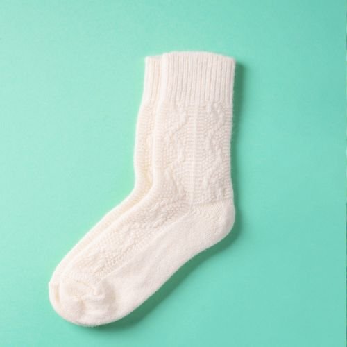 a pair of white angora wool socks